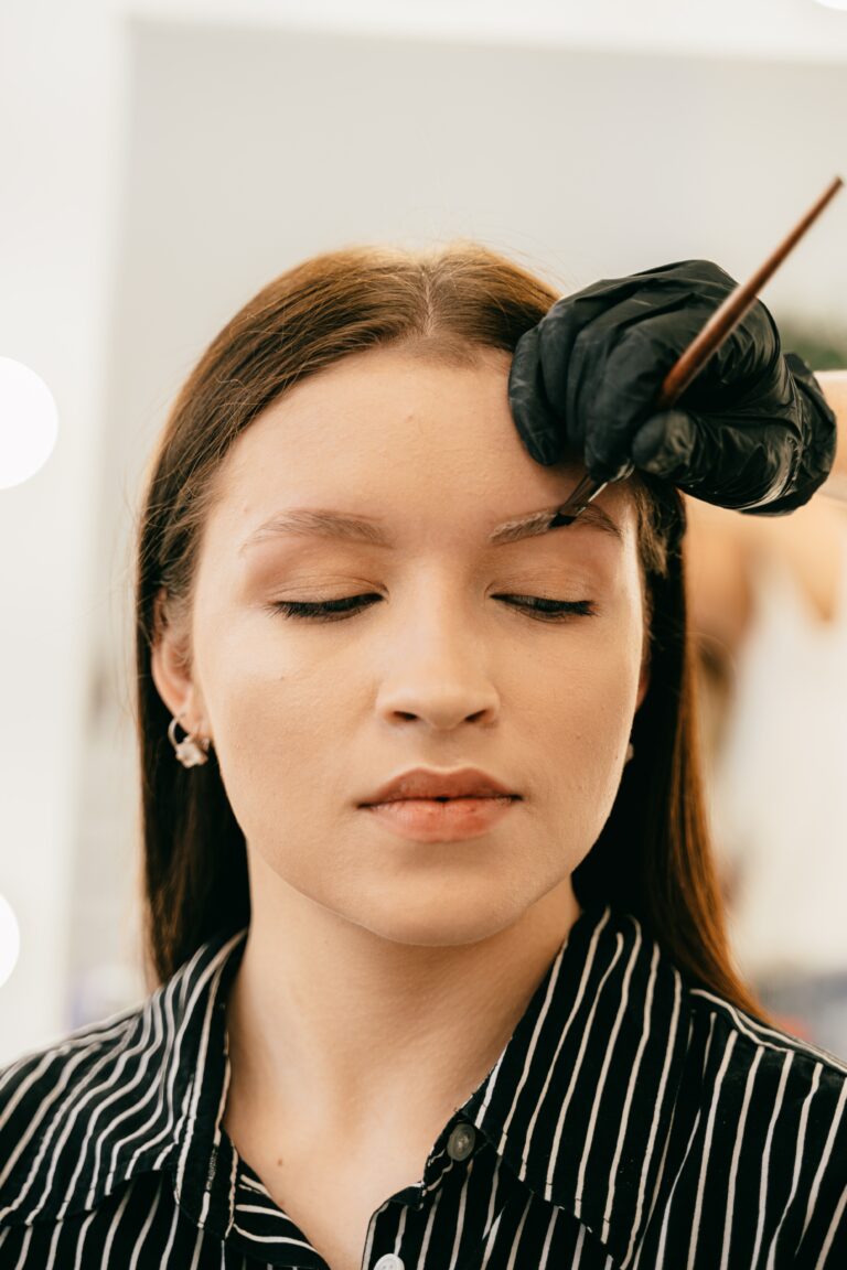 microblading - a woman getting her eyebrows done